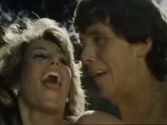 In a captivating scene from a vintage sex film, lustful lovers engage in passionate outdoor sex.